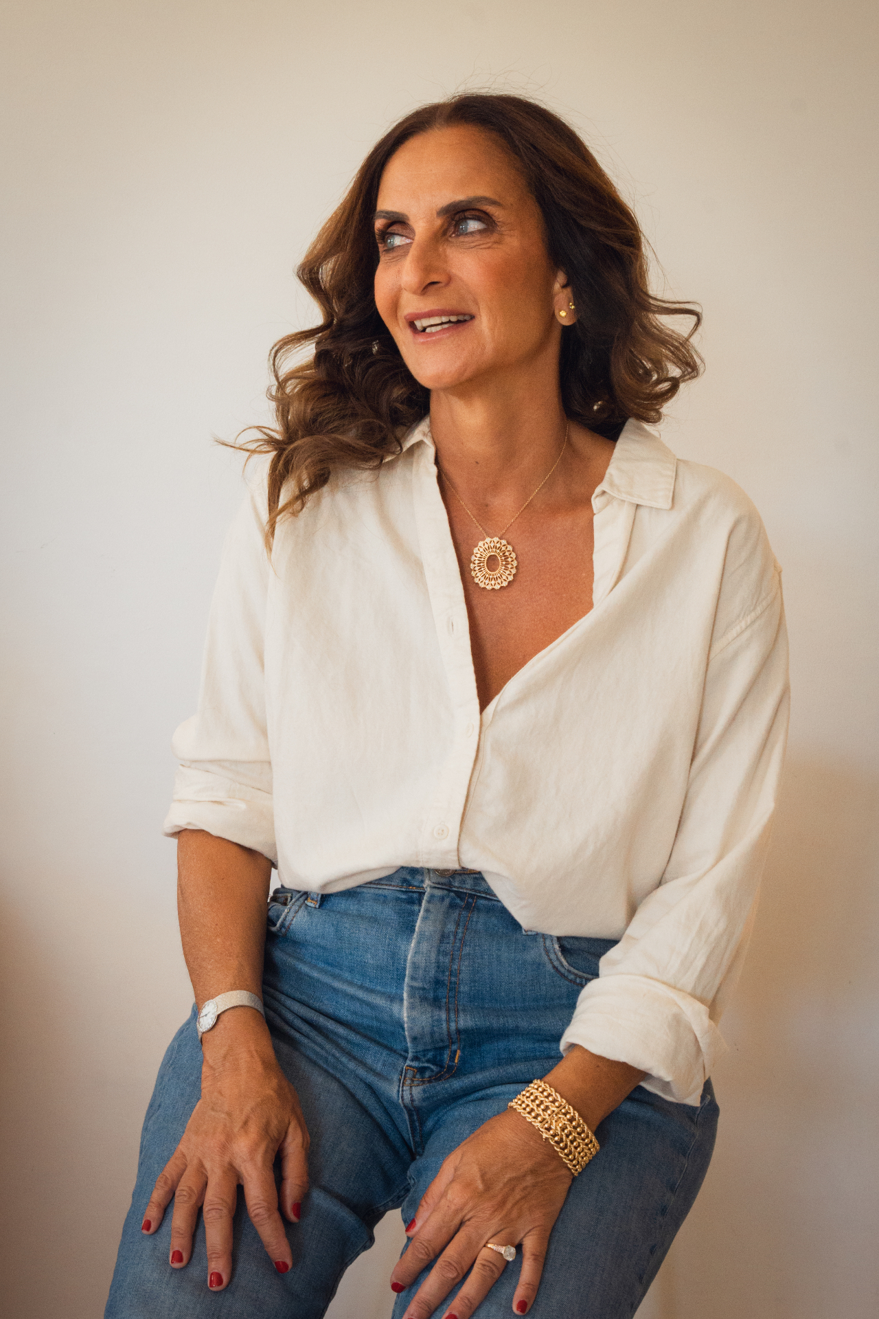 Portrait of Melissa smiling in a white shirt